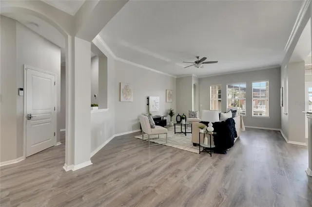 a view of a dining room with furniture window and wooden floor