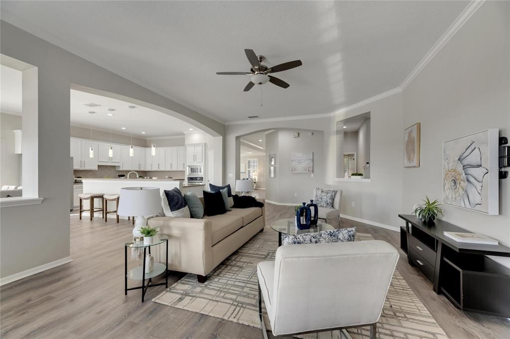 528 Islebay Drive Apollo Beach, FL 33572 - Photo 18 of 98 a living room with furniture or kitchen view and a chandelier