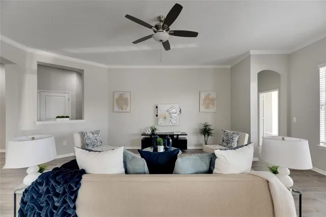 a kitchen with granite countertop white cabinets and stainless steel appliances