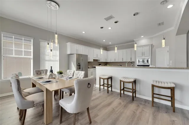 a kitchen with white cabinets and a sink