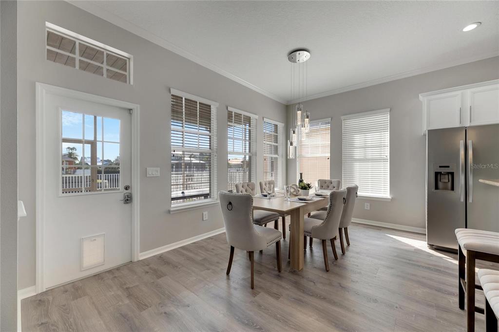 528 Islebay Drive Apollo Beach, FL 33572 - Photo 23 of 98 a view of a dining room with furniture window and wooden floor