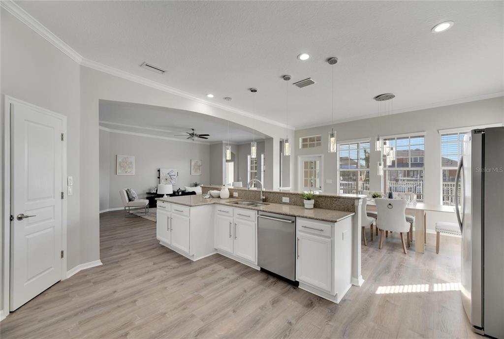 528 Islebay Drive Apollo Beach, FL 33572 - Photo 26 of 98 a kitchen with lots of counter top space and dining table