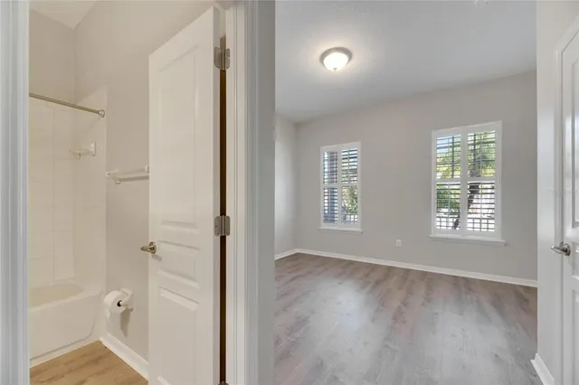 a bedroom with a large bed and a couch