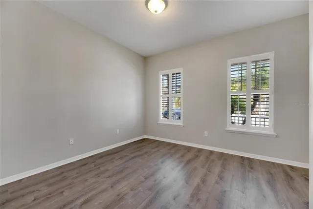 a bathroom with a tub and a window
