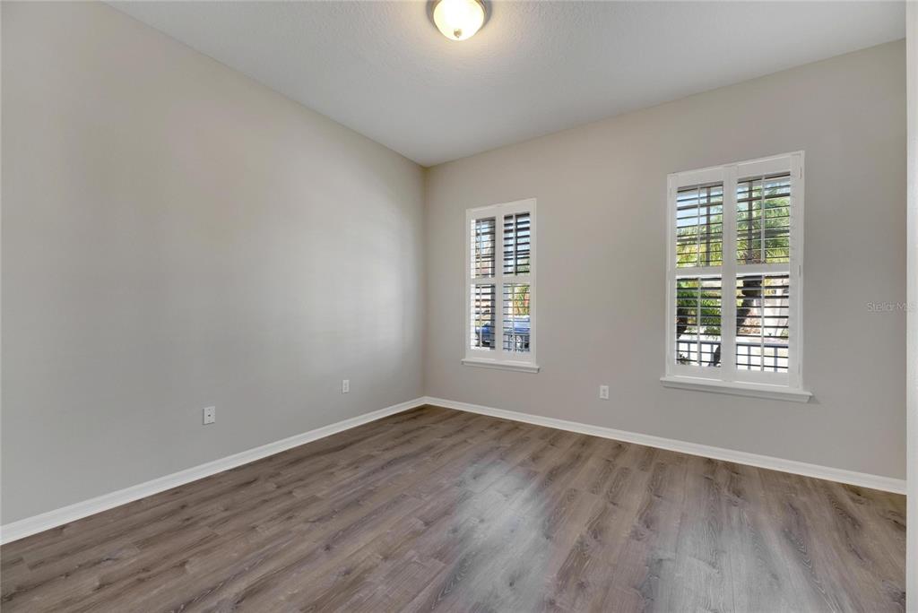 528 Islebay Drive Apollo Beach, FL 33572 - Photo 35 of 98 an empty room with wooden floor and windows