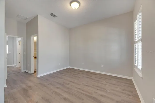 a white toilet sitting next to a shower