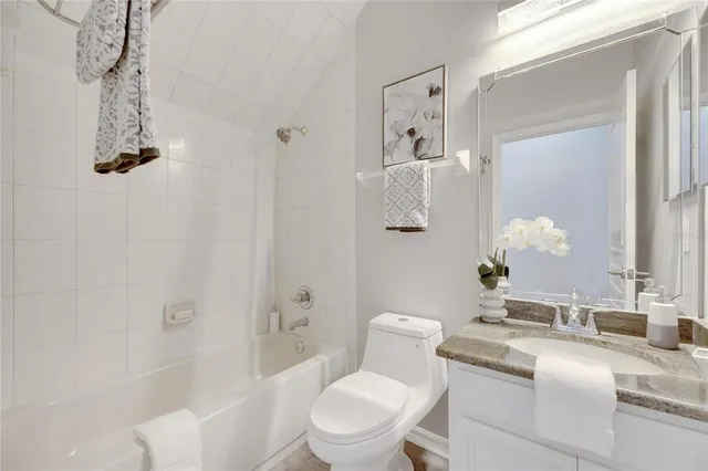 a bathroom with a shower and a tub