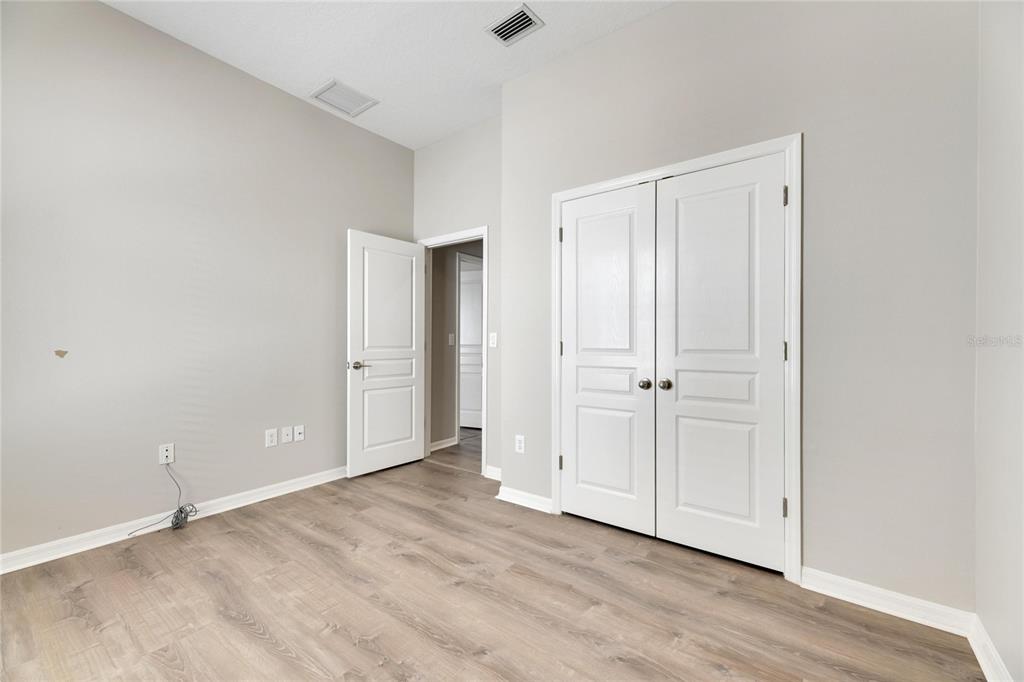 528 Islebay Drive Apollo Beach, FL 33572 - Photo 42 of 98 a view of an empty room with wooden floor