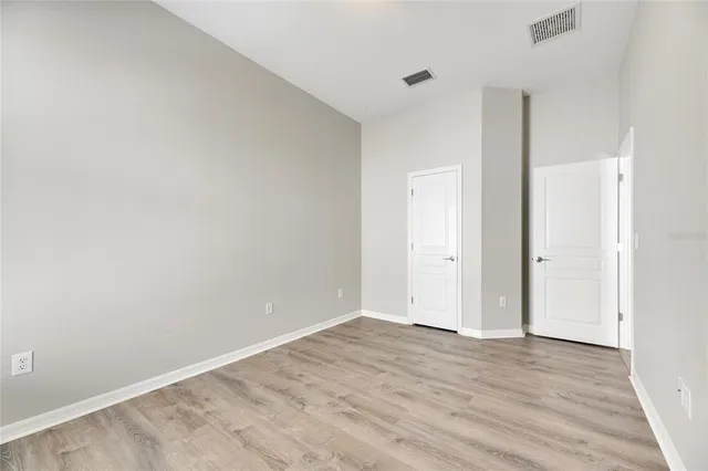 an aerial view of a house with garden space and street view