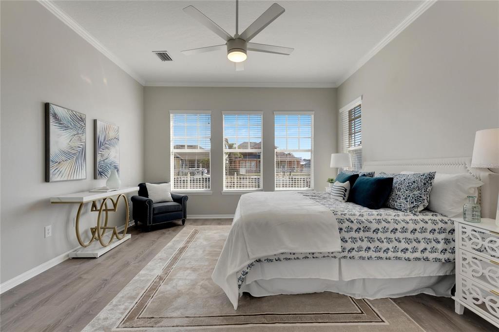 528 Islebay Drive Apollo Beach, FL 33572 - Photo 50 of 98 a bedroom with a large bed and a couch