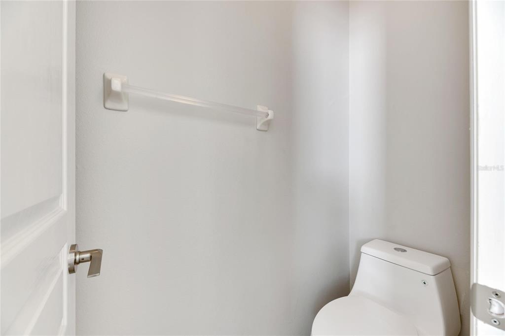 528 Islebay Drive Apollo Beach, FL 33572 - Photo 56 of 98 a white toilet sitting next to a shower