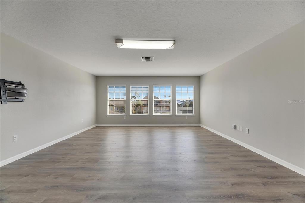 528 Islebay Drive Apollo Beach, FL 33572 - Photo 62 of 98 wooden floor in an empty room with a window