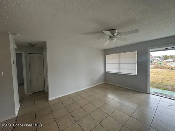 a view of an empty room and window