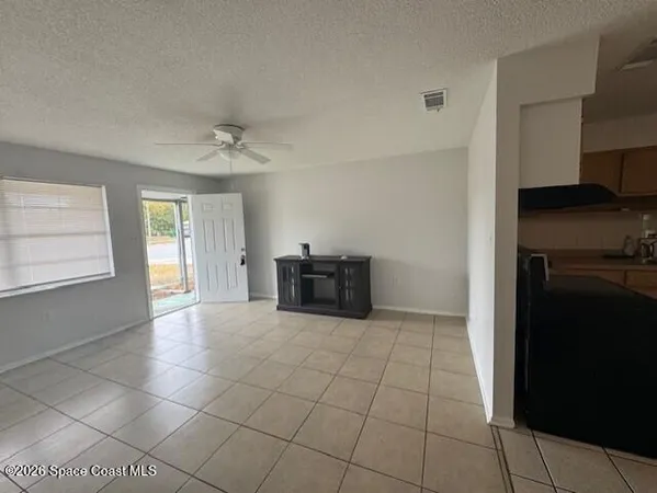 a kitchen with granite countertop a stove and a refrigerator