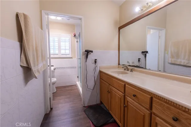 a bathroom with a double vanity sink a and a mirror