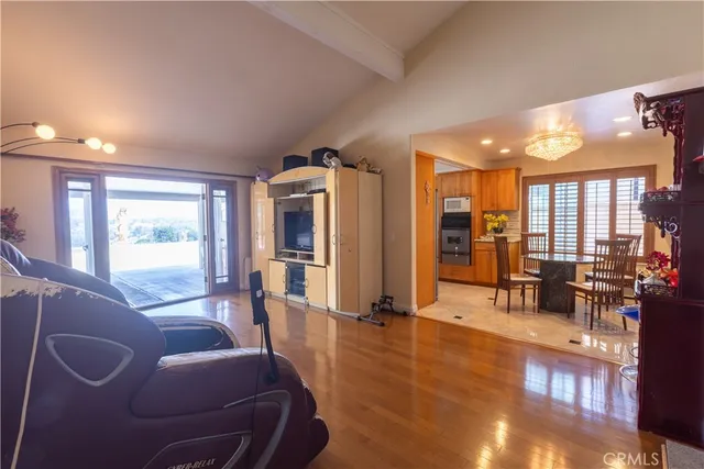a living room with furniture window and wooden floor
