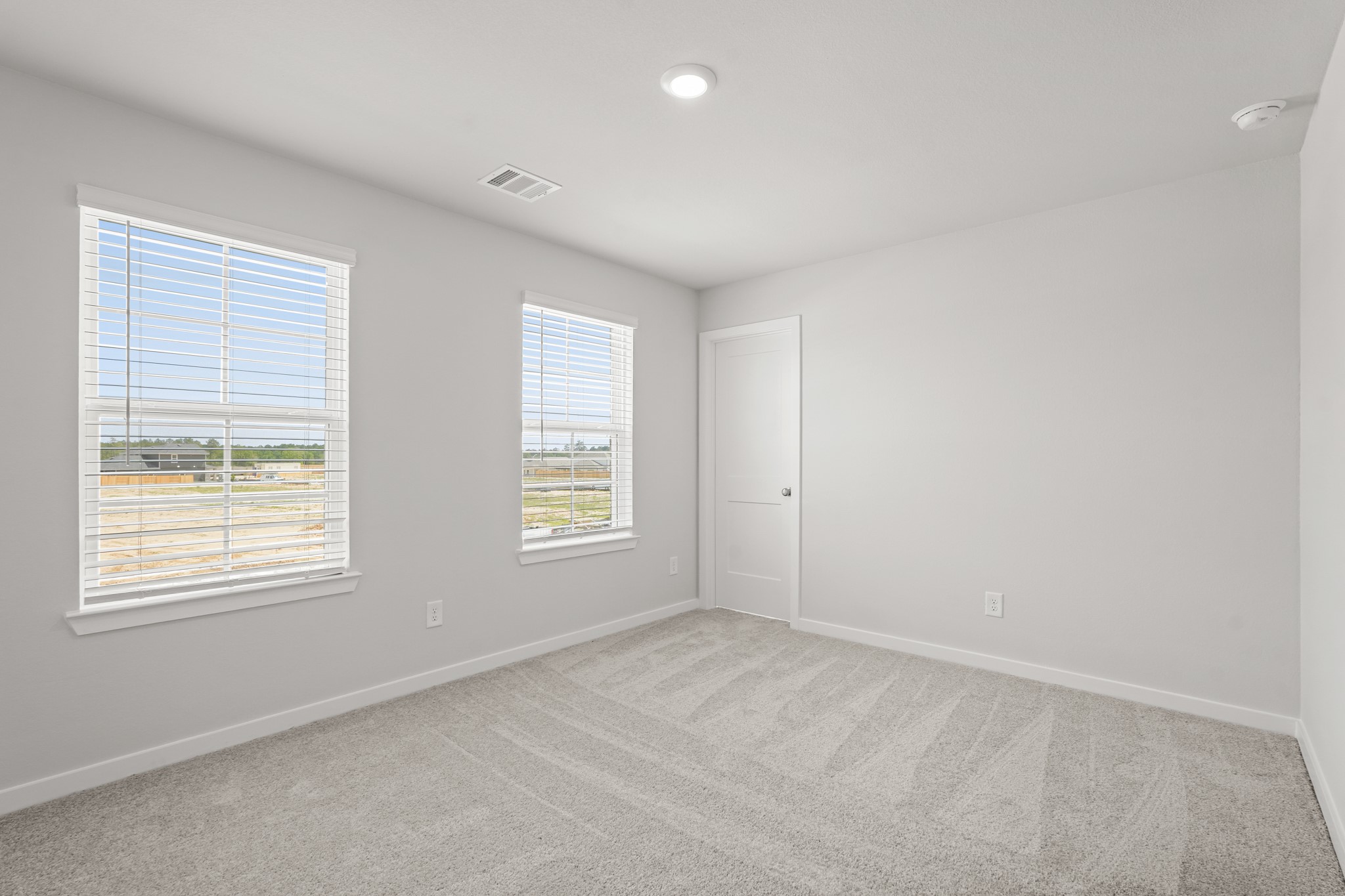 213 Spring Drive Hockley, TX 77447 - Photo 19 of 26 an empty room with windows