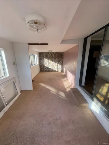 a view of livingroom with a ceiling fan