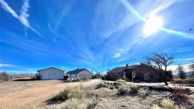 a view of large house with a yard