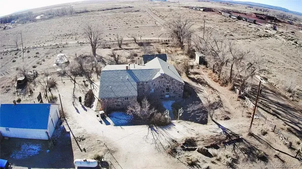 a view of a livingroom with furniture and a window