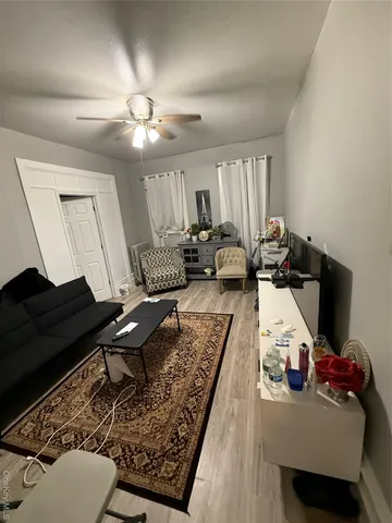 a living room with furniture and a rug