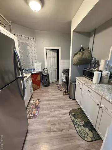 a room with a bed and furniture