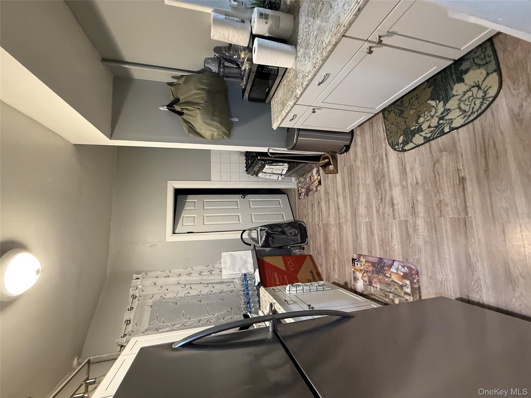 950 Hoe Avenue, Unit 4D Bronx, NY 10459 - Photo 3 of 8 a room with a bed and furniture