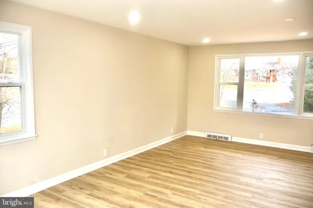 a bathroom with a white shower and a toilet