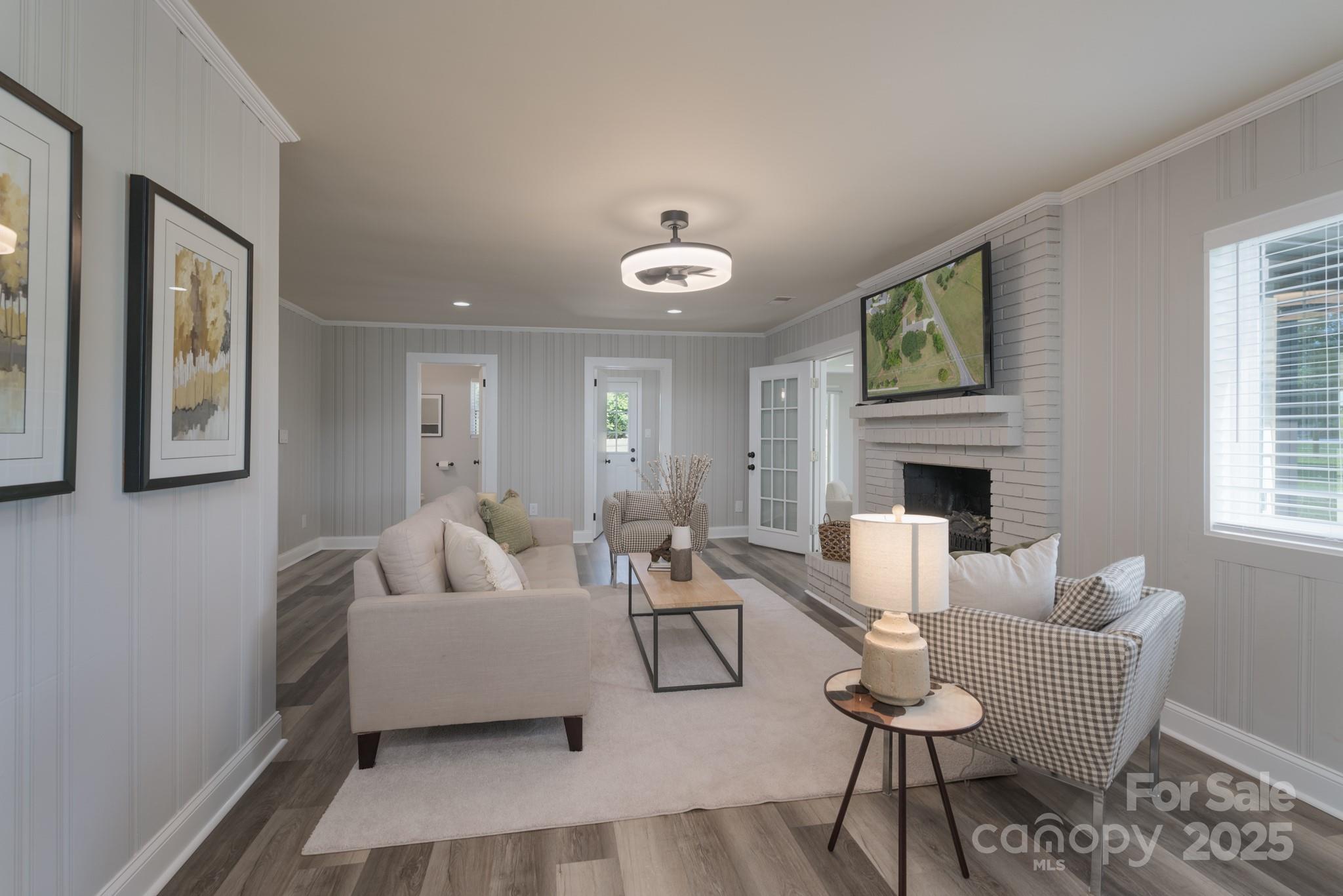 6211 Rock Island Road Charlotte, NC 28278 - Photo 16 of 36 a living room with furniture and a fireplace