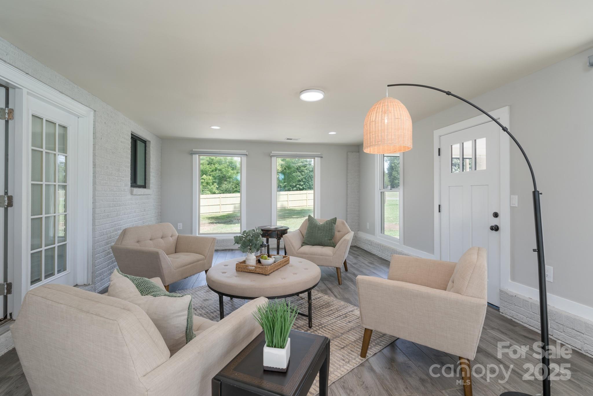6211 Rock Island Road Charlotte, NC 28278 - Photo 20 of 36 a living room with furniture and a large mirror next to a window