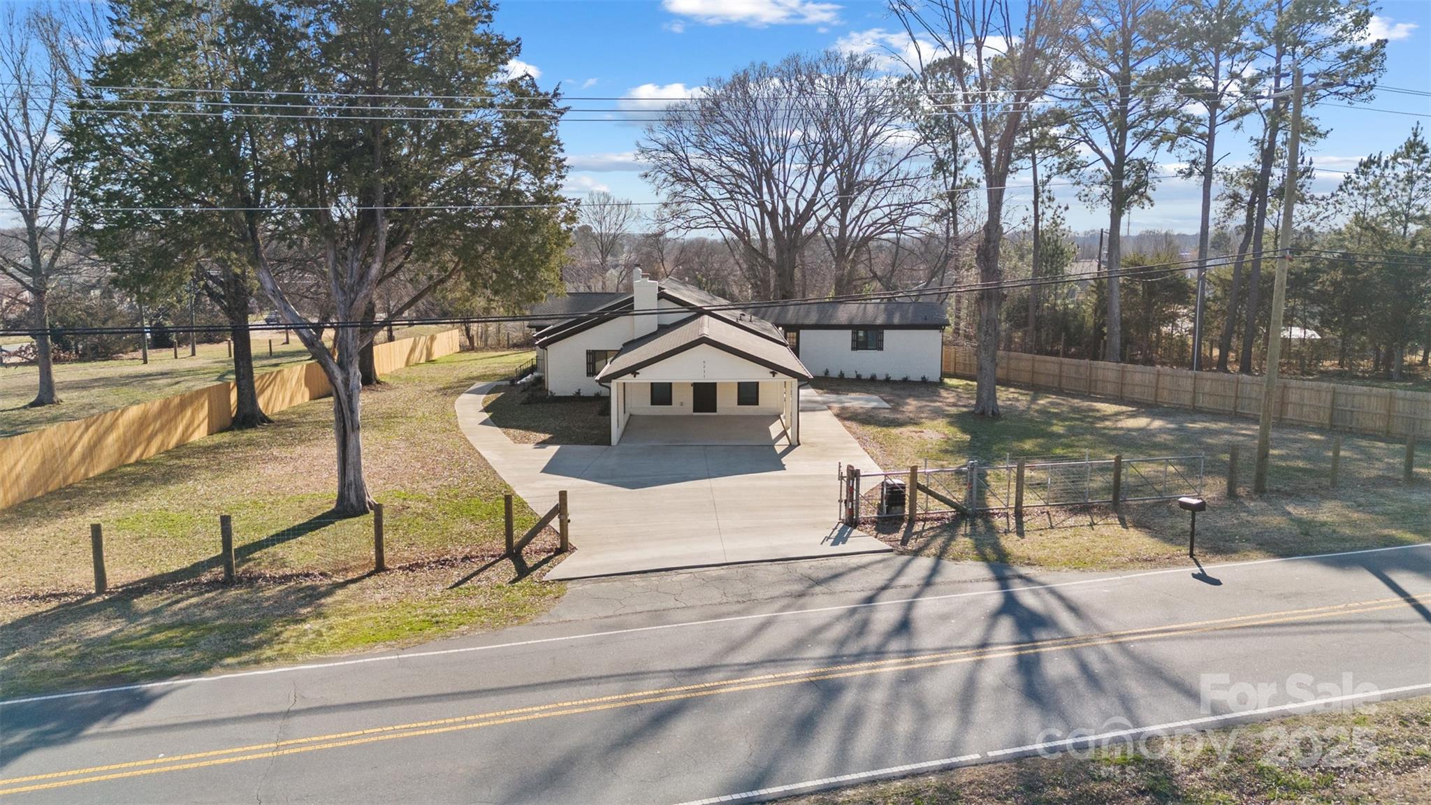 6211 Rock Island Road Charlotte, NC 28278 - Photo 2 of 36 a house view with a outdoor space