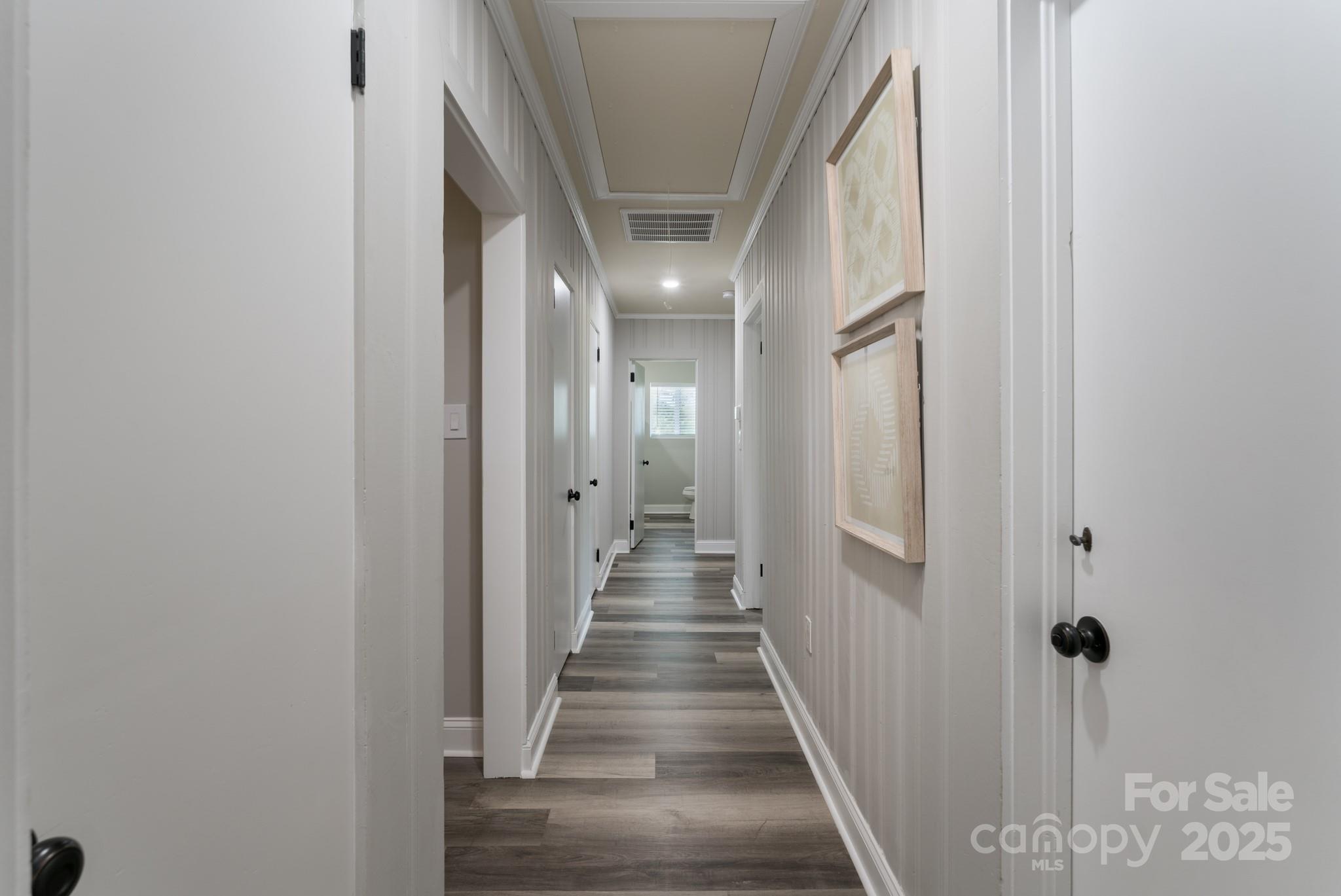 6211 Rock Island Road Charlotte, NC 28278 - Photo 21 of 36 a view of a hallway with wooden floor and staircase