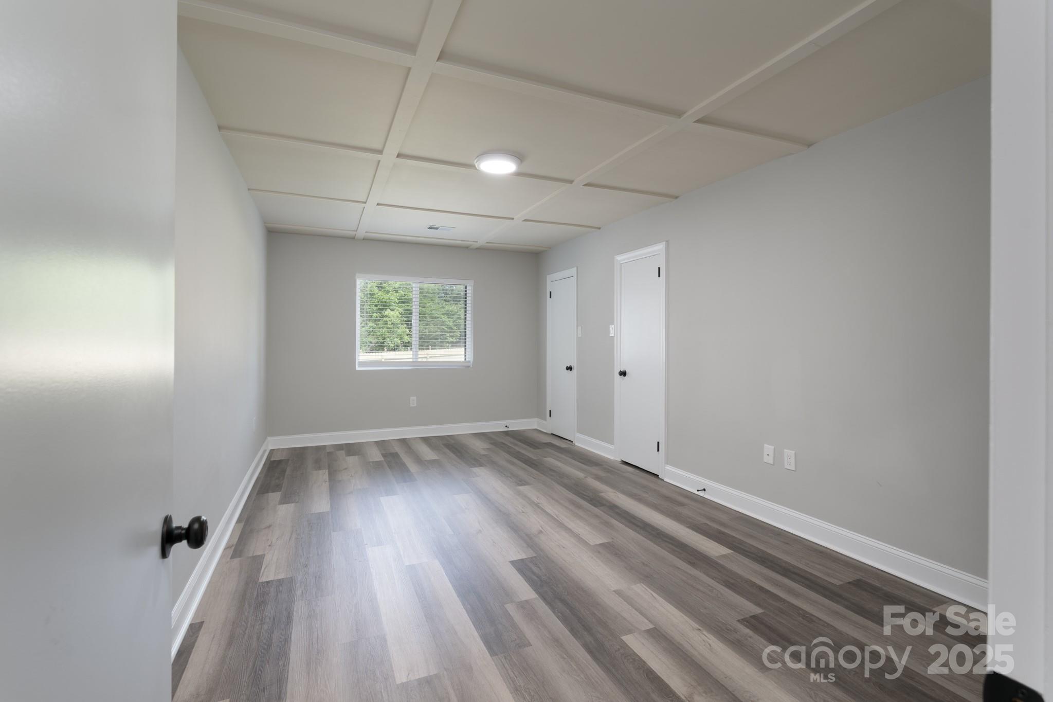 6211 Rock Island Road Charlotte, NC 28278 - Photo 22 of 36 wooden floor in an empty room with a window