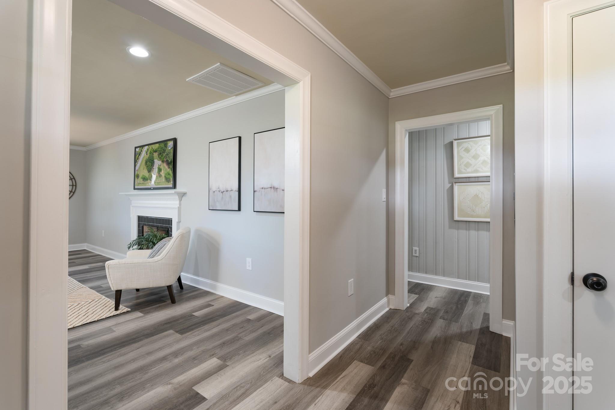 6211 Rock Island Road Charlotte, NC 28278 - Photo 3 of 36 a view of a hallway with wooden floor and furniture