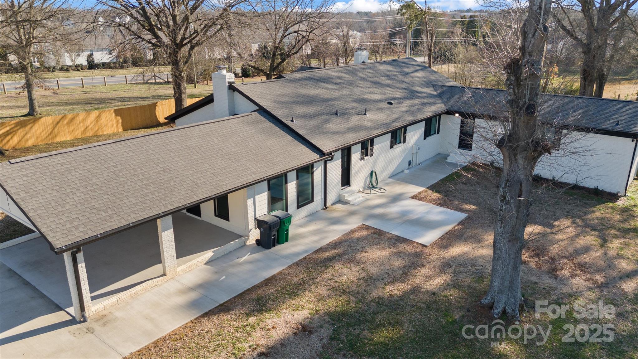 6211 Rock Island Road Charlotte, NC 28278 - Photo 33 of 36 a view of a house with roof deck