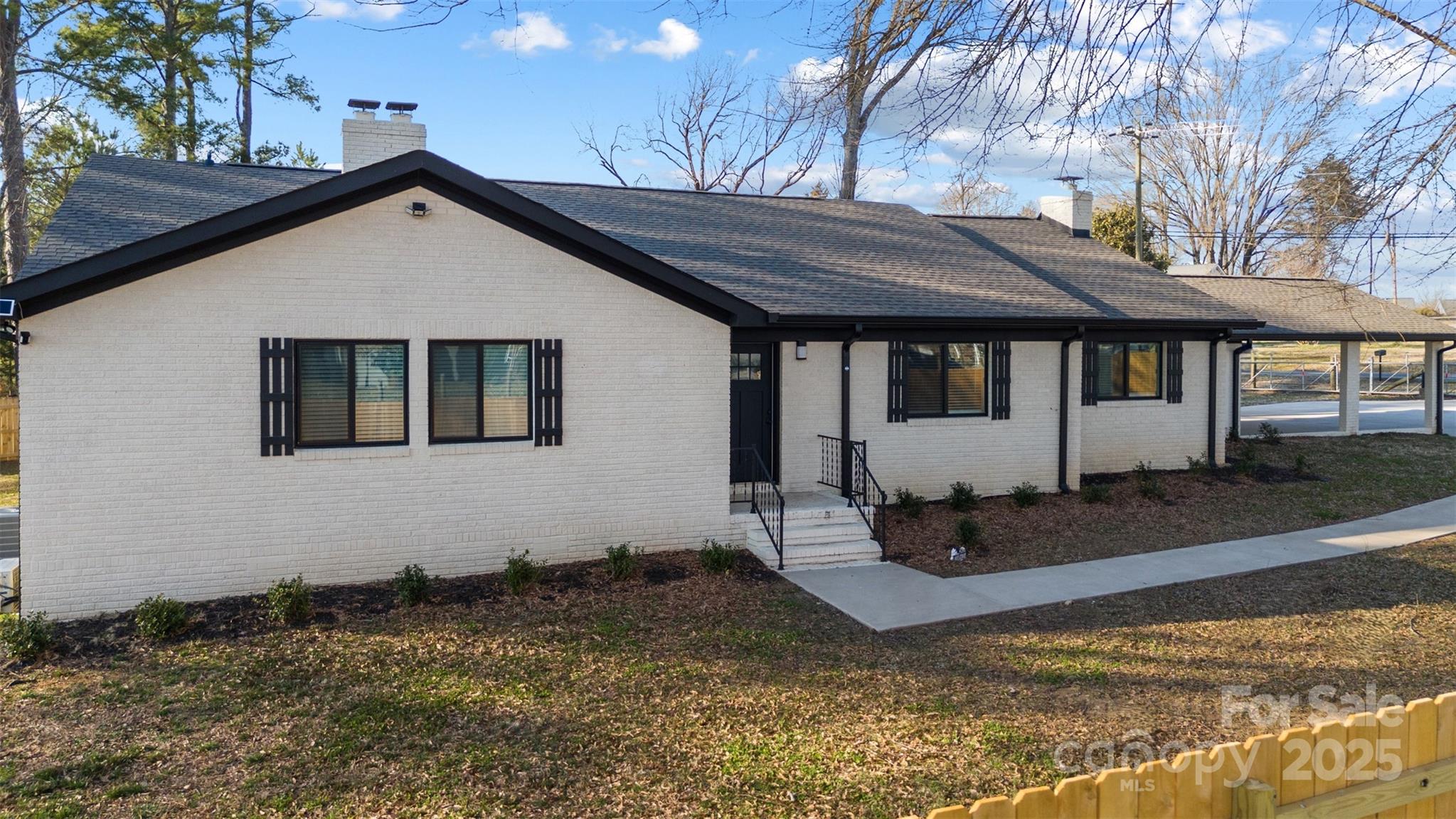 6211 Rock Island Road Charlotte, NC 28278 - Photo 34 of 36 a front view of a house with a yard