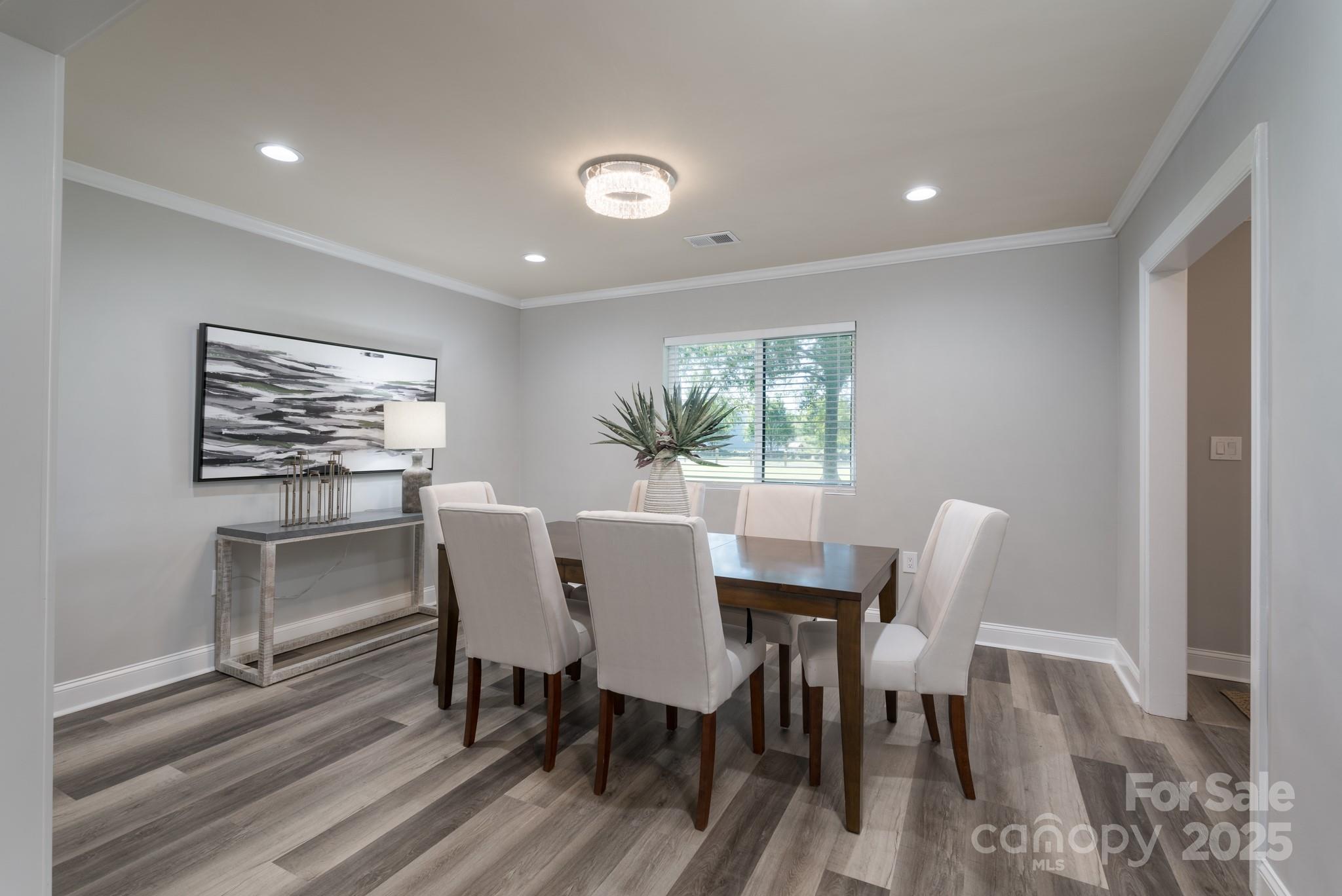 6211 Rock Island Road Charlotte, NC 28278 - Photo 8 of 36 a view of a dining room with furniture window and wooden floor