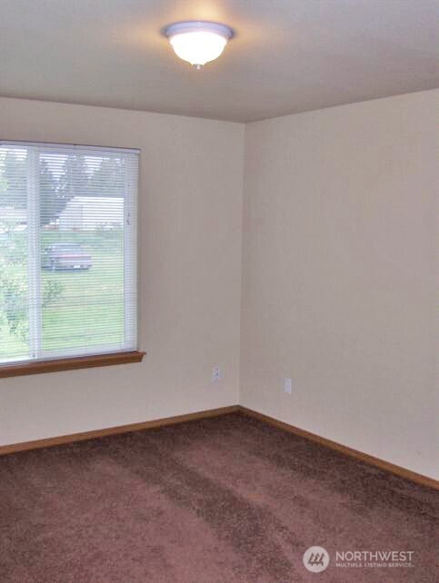 6521 201st Avenue Southwest Centralia, WA 98531 - Photo 12 of 16 an empty room with a window
