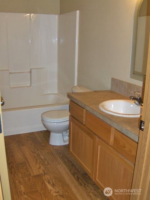 6521 201st Avenue Southwest Centralia, WA 98531 - Photo 16 of 16 a bathroom with a granite countertop toilet and a sink