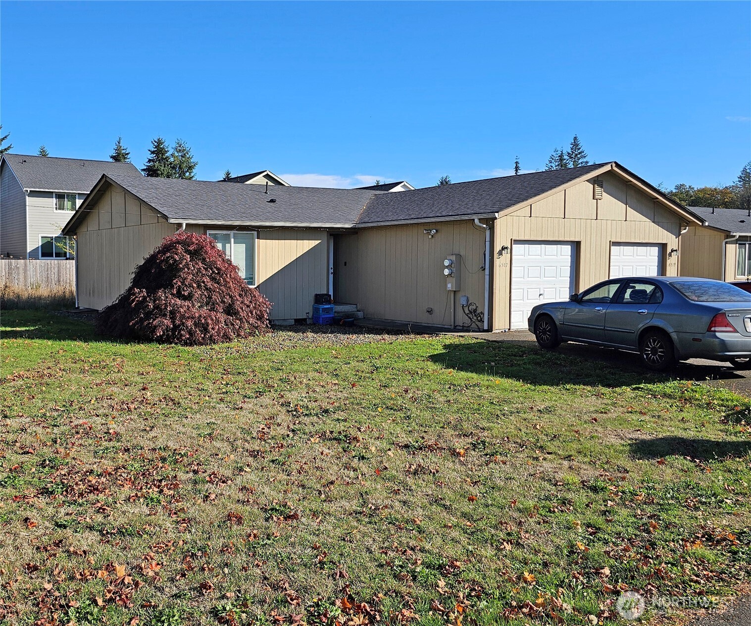 6521 201st Avenue Southwest Centralia, WA 98531 - Photo 2 of 16 a front view of a house with garden
