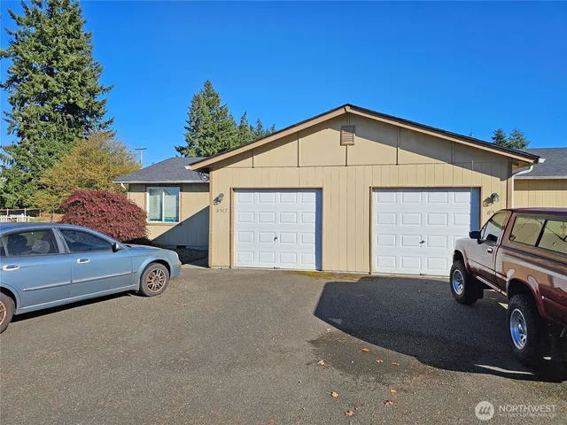 a view of a car parked in front of a house