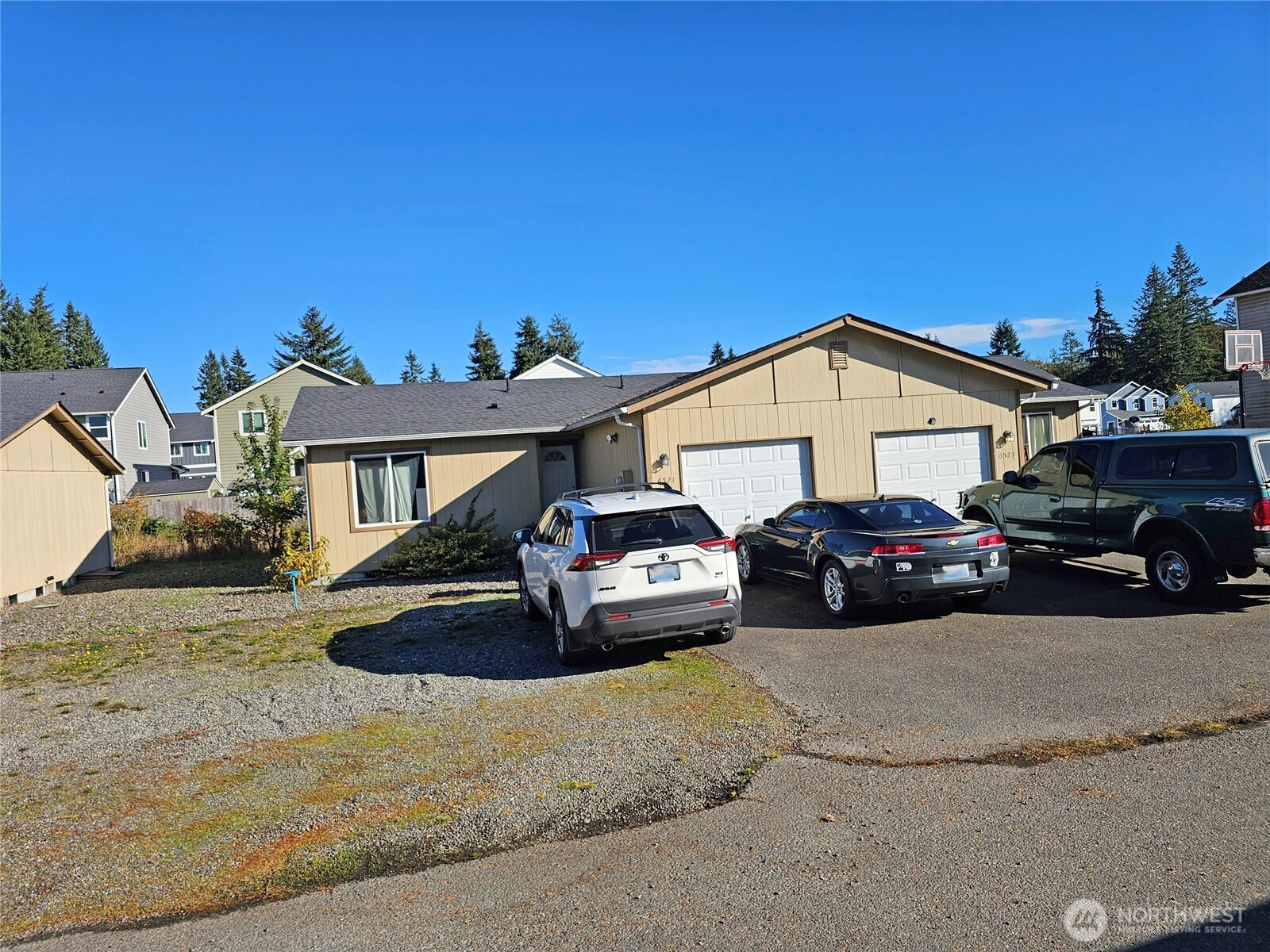 6521 201st Avenue Southwest Centralia, WA 98531 - Photo 10 of 16 a view of a car parked in front of a house