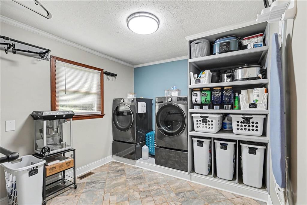 7388 Post Road Winston, GA 30187 - Photo 26 of 32 a utility room with dryer and washer