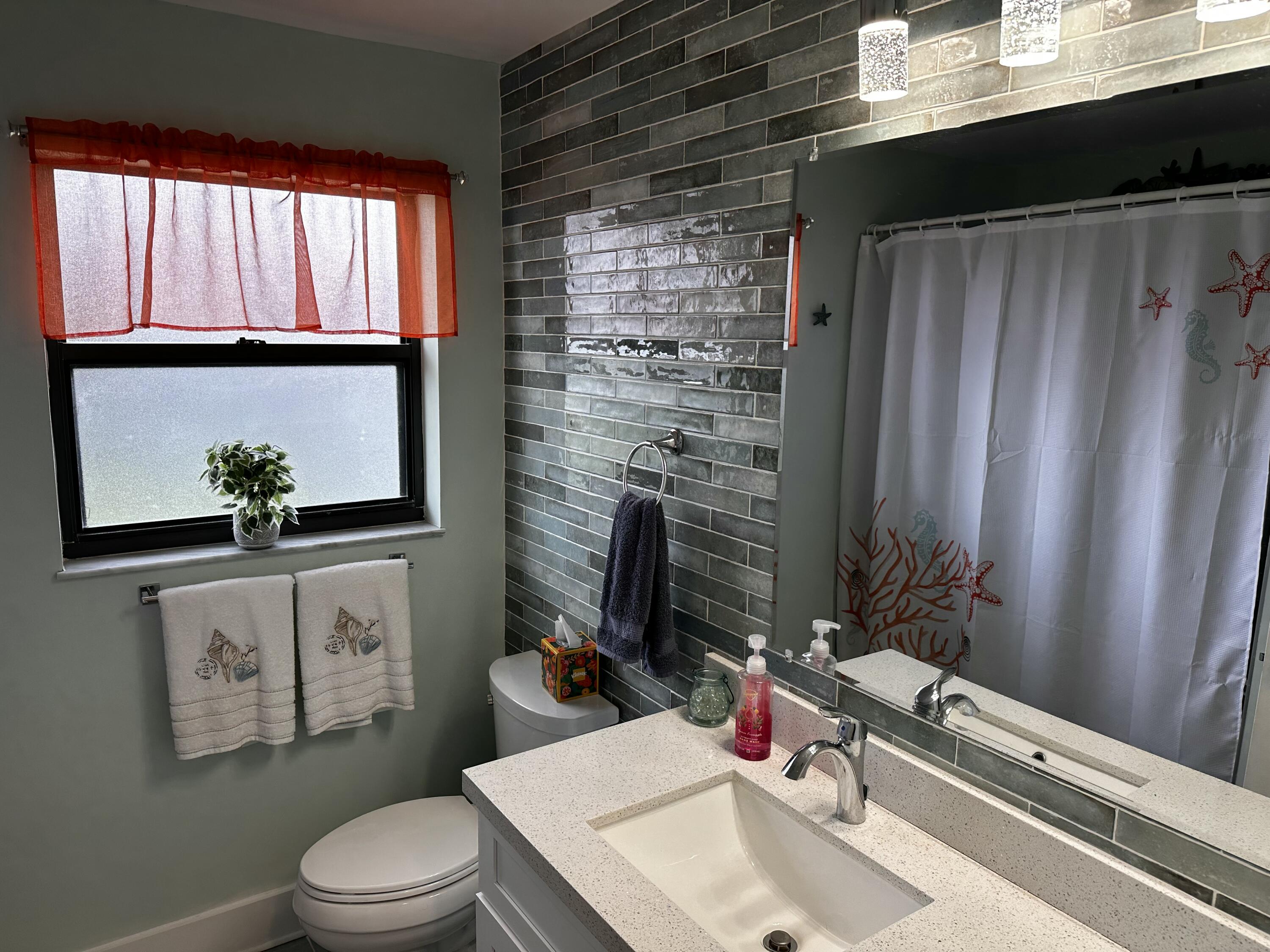 6142 Southeast Landing Way, Unit 16 Stuart, FL 34997 - Photo 59 of 73 Guest Bathroom