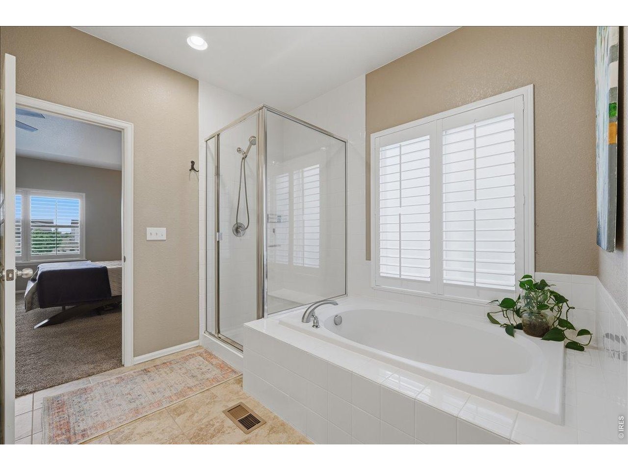 6096 Story Road Timnath, CO 80547 - Photo 22 of 50 a bathroom with a bathtub and a shower