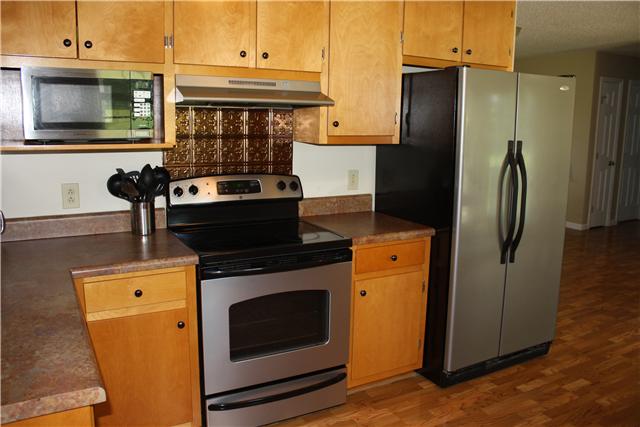 880 Barnette Road Minor Hill, TN 38473 - Photo 10 of 19 Kitchen - microwave, range hood and smooth top.