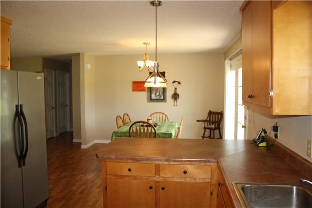 880 Barnette Road Minor Hill, TN 38473 - Photo 11 of 19 Kitchen to Eat-in & hall to secondary bedrooms.