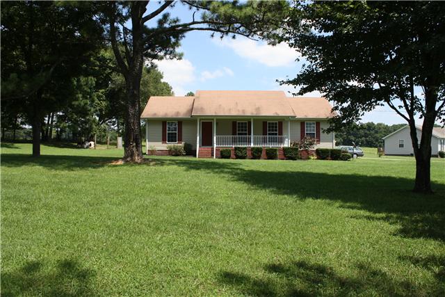 880 Barnette Road Minor Hill, TN 38473 - Photo 18 of 19 Great curb appeal, level land, field across the road, tree-lined backyard.