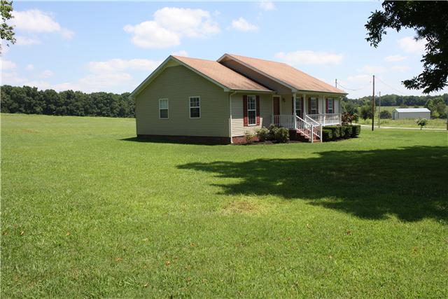 880 Barnette Road Minor Hill, TN 38473 - Photo 2 of 19 Front left view w/ tree-lined backyard and field across road.