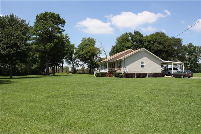 880 Barnette Road Minor Hill, TN 38473 - Photo 3 of 19 Front Right side - Covered Front Porch, 2 car carport, Mature trees in front yard, side and rear.